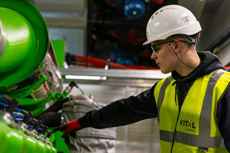 Worker in a hard hat and high-visibility vest